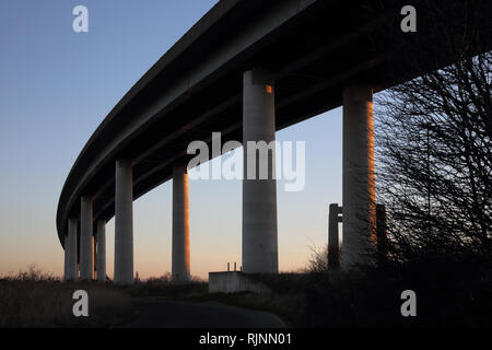 the road bridge connecting the isle of sheppey to  kent over the river swale england Stock Photo