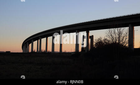 the road bridge connecting the isle of sheppey to  kent over the river swale england Stock Photo