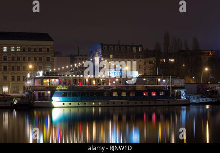 Hostel ships in River Spree Berlin by night. Near Eastside Gallery. Multiple colored lights Stock Photo