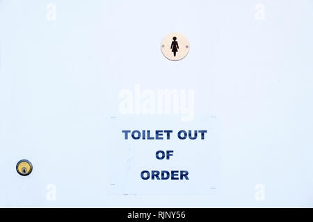 Male toilet broken out of order sign Stock Photo - Alamy