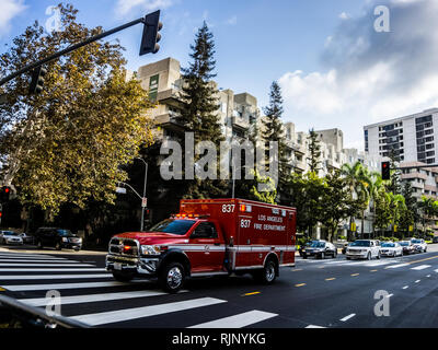 Los Angeles, USA - July 29, 2018: Fire truck rides a call down the street in Los Angeles. Stock Photo