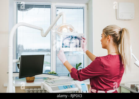 Panoramic dental X-Ray in hand, dental office Stock Photo