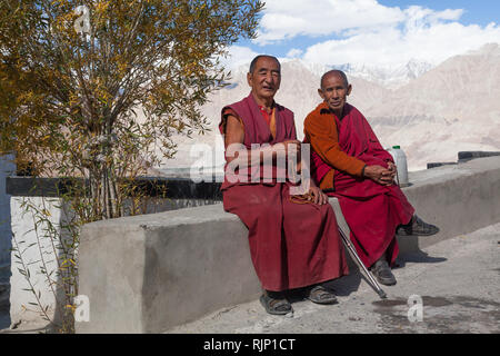 Two monks in Diskit Monastery (also known as Diskit Gompa or Deskit Gompa), Nubra Valley, Ladakh, Jammu and Kashmir, India Stock Photo