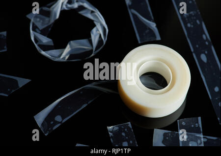 White duct tape lay on black background with strips Stock Photo