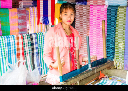 Mae Hong Son, Thailand - 7th February 2019: Karen woman weaving. They make a variety of designs from cotton. Stock Photo