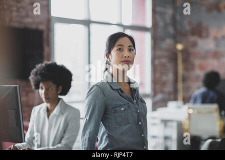Portrait of Asian businesswoman in a working office Stock Photo