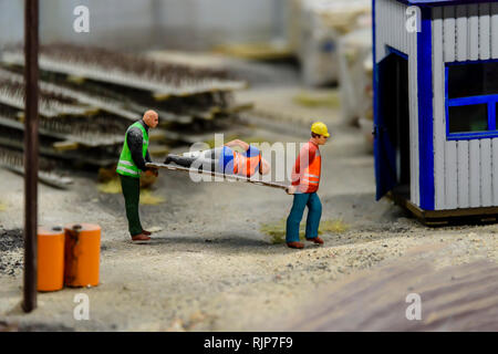 Miniature model of an injured builder on a building site , at Kolejkowo, Wrocław, Wroclaw, Wroklaw, Poland Stock Photo