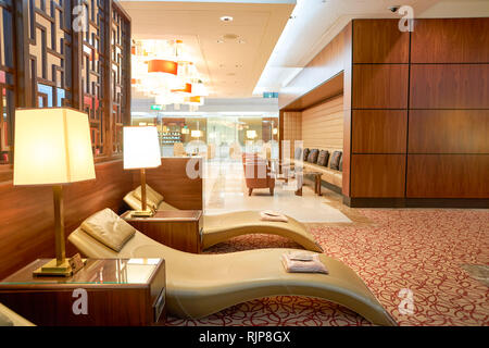 DUBAI, UAE - CIRCA APRIL, 2016: interior of Emirates business class lounge. Emirates is the largest airline in the Middle East. It is an airline based Stock Photo