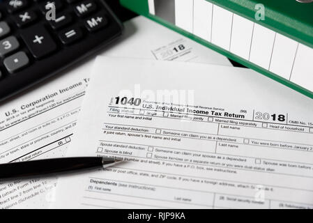 U.S. Individual income tax return. USA tax forms on desk Stock Photo