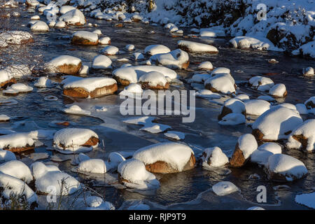 Snow covered boulders in the River Etive, Glen Etive, Highland Region, Scotland Stock Photo