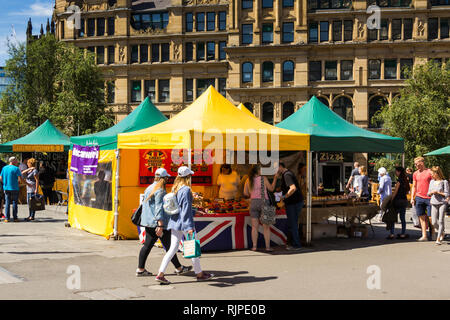 Street food market stalls in Exchange Square, Manchester, outside the old Corn Exchange. Stock Photo