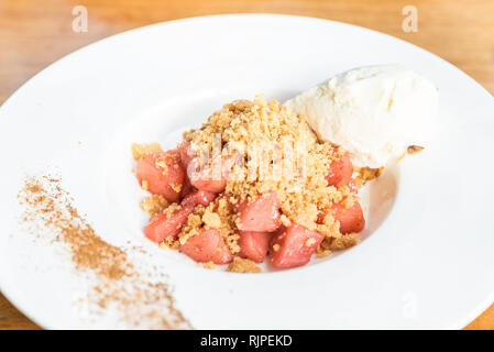 apple crumble with Icecream and cinnamon powder Stock Photo