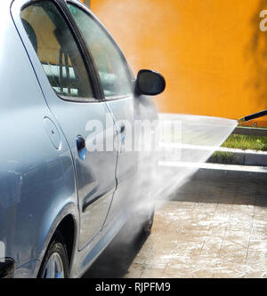 Pressure Washer Machine Cleaning Foam From The Car Door Stock Photo