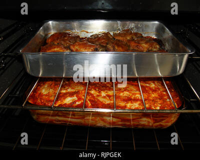 Meal, chicken and lasagne in the oven, São Paulo, Brazil Stock Photo