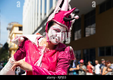 A female street entertainer dressed in costume performs for the crowds in Havana Cuba Stock Photo