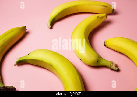 bananas on a pink background. Fashion photo of bananas on the background, beautiful pattern Stock Photo