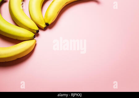 bananas on a pink background. Fashion photo of bananas on the background, beautiful pattern Stock Photo