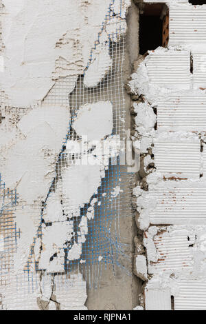 Plaster spall on the wall of a rough building in Caceres, Extremadura, Spain. Stock Photo