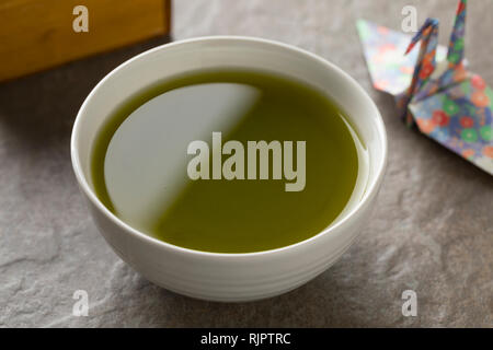 Cup of Japanese catechin green powder tea close up Stock Photo