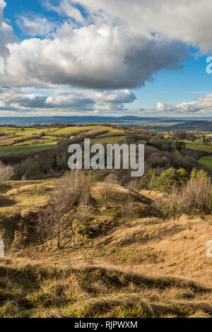 View from the summit of Painswick Beacon in the Cotswolds, Goucestershire, UK. Standing on the hill fort looking out across the plain of the river Sev Stock Photo