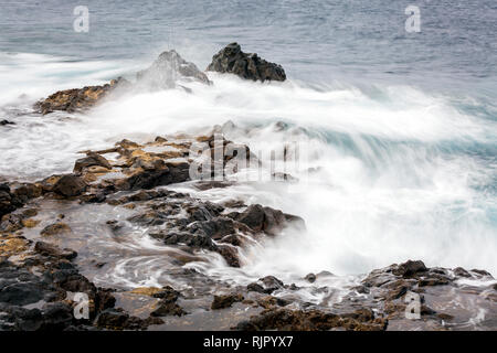 Rough seas swirling around rocks on the east coast of Tenerife, Canary Islands, Spain Stock Photo