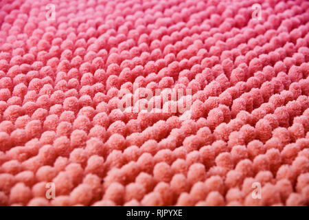 Coral knitted fabric background texture, mat close up. Coral canvas, texture of burlap. Stock Photo