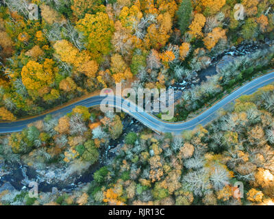 Aerial Drone view of Autumn / fall in the Blue ridge of the Appalachian Mountains near Asheville, North Carolina. Vibrant red, yellow, orange leaf fol Stock Photo