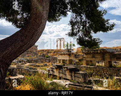 Ruins of ancient city of Corinth and Temple of Apollo shot at serene daytime Stock Photo