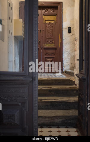 Front door of ghetto building with porch Stock Photo