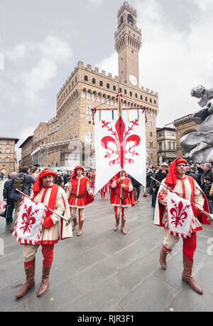 Standard bearer and trumpet player with historical coat of arms of Florence, parades in the Piazza della Signoria. Stock Photo