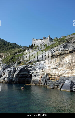 The fortification ' Castello Doria' overlooking Byron Cave, on the coast of Portovenere, Cinque Terre National Park in Italy Stock Photo