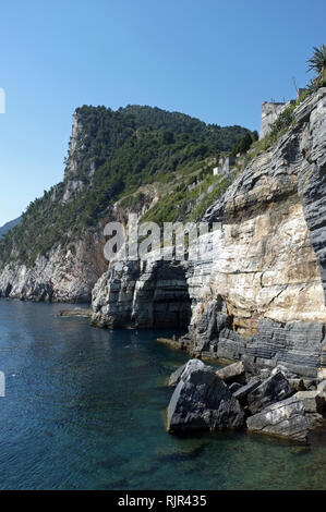 The fortification ' Castello Doria' overlooking Byron Cave, on the coast of Portovenere, Cinque Terre National Park in Italy Stock Photo