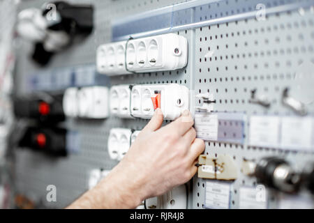 Choosing elecrical sockets in the shop with electrical goods, close-up view Stock Photo