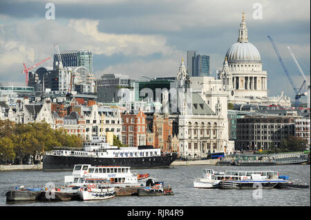 Victoria Embankment, HMS President, JP Morgan, City of London and Baroque St Paul's Cathedral built 1697 by Christopher Wren on Ludgate Hill in London Stock Photo