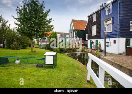The old traditional colorful houses at the canal in the Dutch fisherman village. Stock Photo