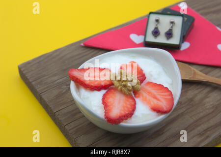 Breakfast prepared for some woman who wants to offer some earrings as a gift some day designated as Valentine's Day, a birthday, Christmas, Mother's D Stock Photo