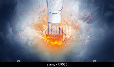 Hand hits strongly and makes fire beam around  Stock Photo