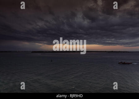 Evening view of Sant'Erasmo island in the Venice lagoon during a thunderstorm Stock Photo