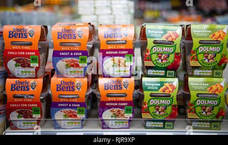 A selection of pasta and rice pot ready meals on sale in a supermarket store in the UK. Stock Photo