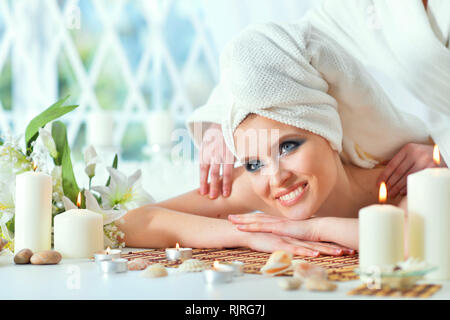 girl lying down on a massage bed Stock Photo