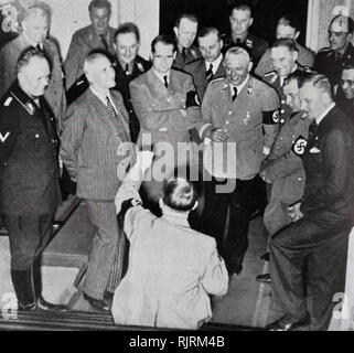 German Nazi Party Robert Ley, Adolph Hitler, and Rudolph Hess reviewing ...