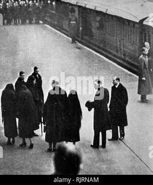 Queen Mary, the Princess Royal and the daughter's in law of the late King George V, wait for his coffin at King's Cross station London. Funeral of King George V (1936); King of the United Kingdom and the British Dominions, and Emperor of India, from 6 May 1910 until his death in 1936. the four sons of the late king (King Edward VIII, the Duke of York, the Duke of Gloucester and the Duke of Kent) take part in the state funeral. Stock Photo