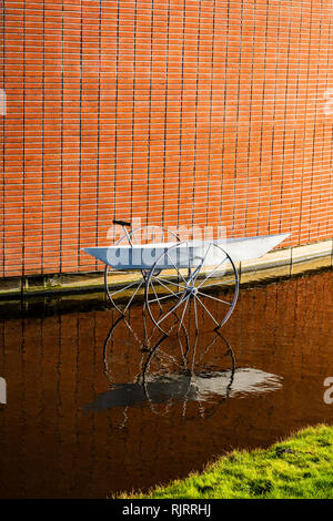 The boat with the wheels in the water Stock Photo