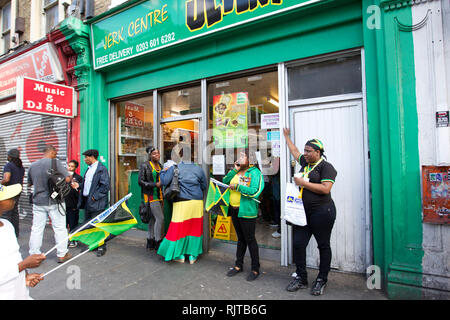 People gather for the annual 'Brixton Splash,' to mark Jamaican Independence Day on August 5, 2012 in London. Stock Photo