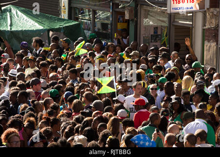 People gather for the annual 'Brixton Splash,' to mark Jamaican Independence Day on August 5, 2012 in London. Stock Photo