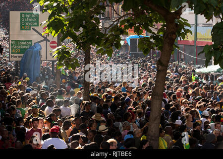 People gather for the annual 'Brixton Splash,' to mark Jamaican Independence Day on August 5, 2012 in London. Stock Photo