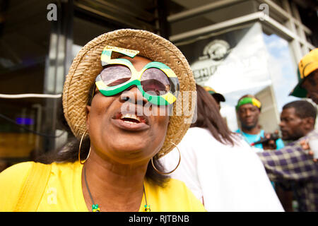 People gather for the annual 'Brixton Splash,' to mark Jamaican Independence Day on August 5, 2012 in London. Stock Photo