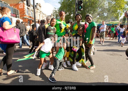 People gather for the annual 'Brixton Splash,' to mark Jamaican Independence Day on August 5, 2012 in London. Stock Photo