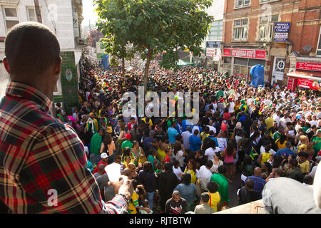 People gather for the annual 'Brixton Splash,' to mark Jamaican Independence Day on August 5, 2012 in London. Stock Photo