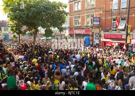 People gather for the annual 'Brixton Splash,' to mark Jamaican Independence Day on August 5, 2012 in London. Stock Photo